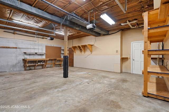 unfinished basement with a workshop area