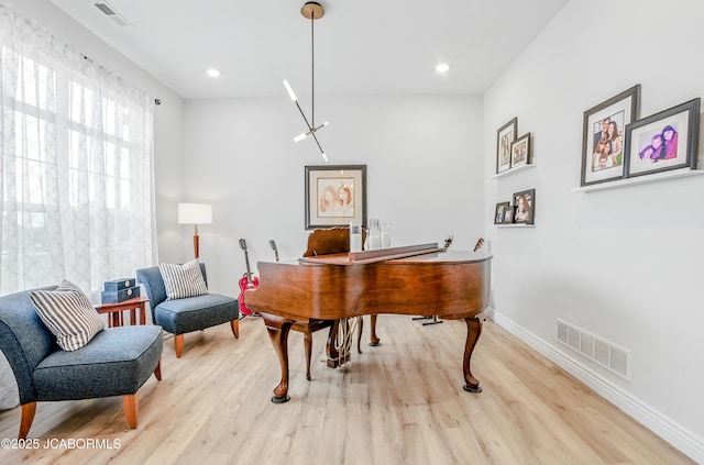 5621 Lightpost Dr, Columbia, MO 65201 - living area featuring wood finished floors and recessed lighting