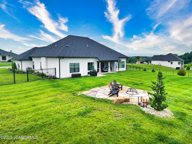 5621 Lightpost Dr, Columbia, MO 65201 - back of property featuring a patio, roof with shingles, and a fenced backyard