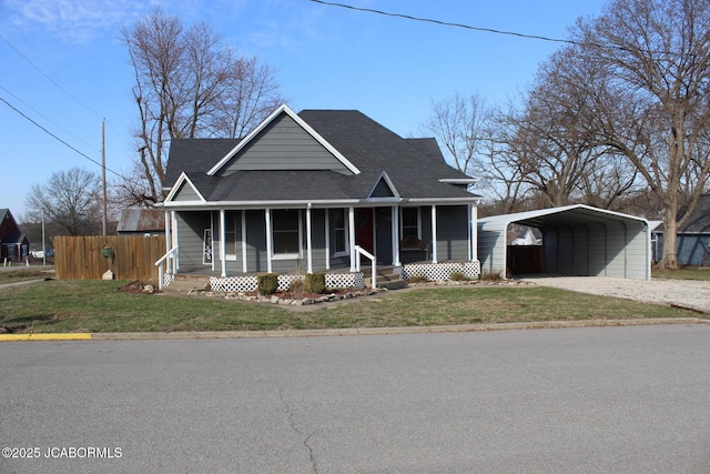 view of front of home with a front lawn, fence, a sunroom, a carport, and driveway