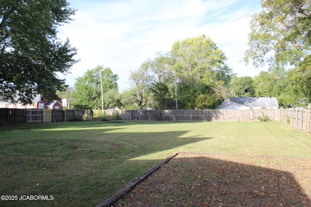 view of yard with a fenced backyard