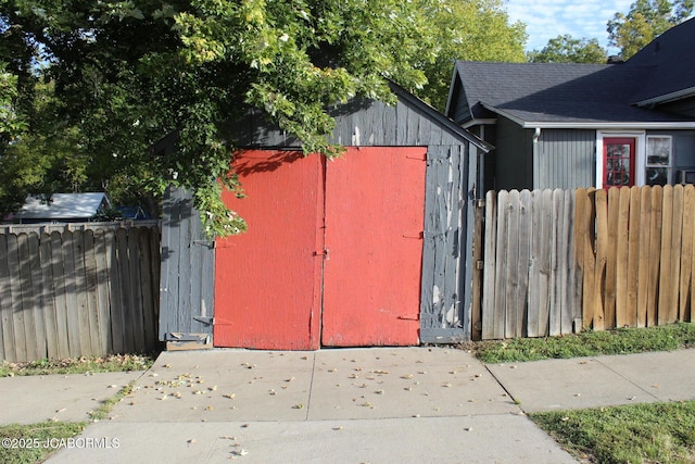 view of shed with fence