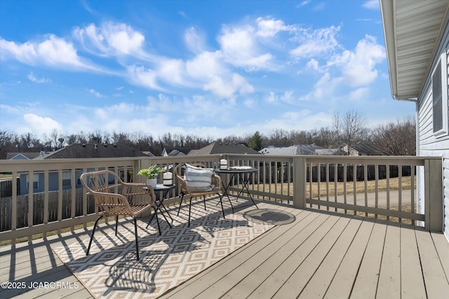 wooden deck with a residential view