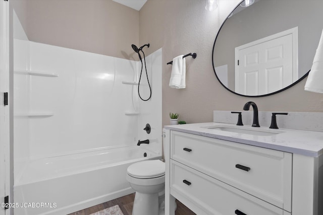 bathroom featuring shower / tub combination, vanity, toilet, and wood finished floors