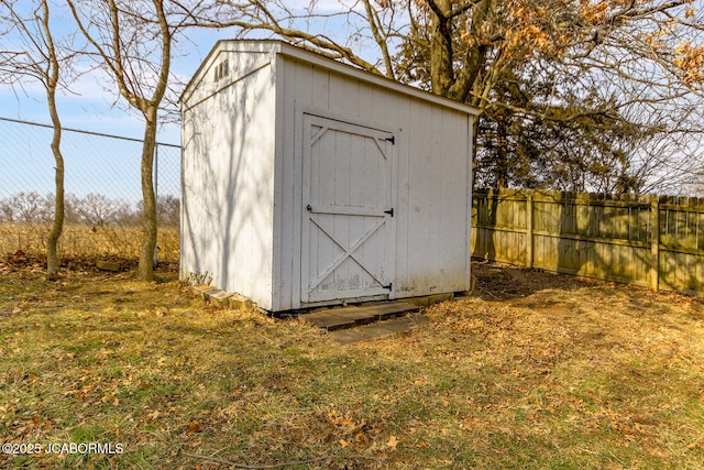 view of outbuilding with a yard