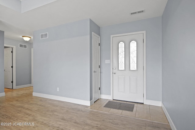 foyer with light hardwood / wood-style floors