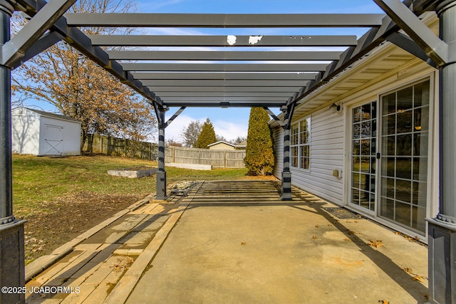 view of patio / terrace featuring a pergola and a storage unit