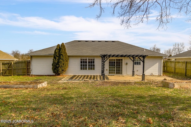 rear view of property with a patio and a lawn