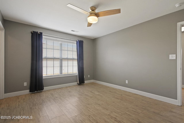 empty room featuring ceiling fan