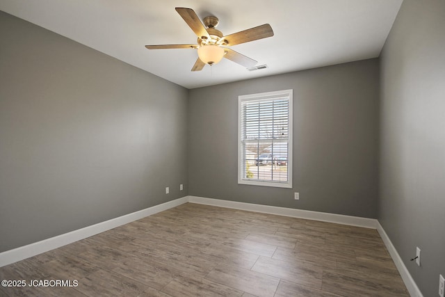 unfurnished room featuring hardwood / wood-style flooring and ceiling fan