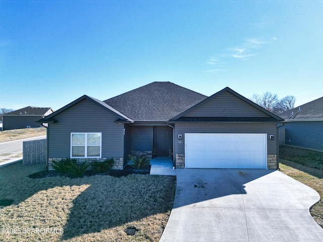 ranch-style home with a garage, stone siding, roof with shingles, and driveway