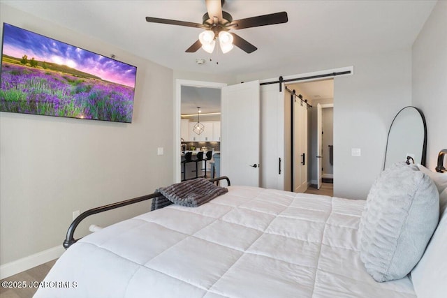1055 Topsider Ln Unit 212, Osage Beach, MO 65065 - bedroom with a barn door and ceiling fan