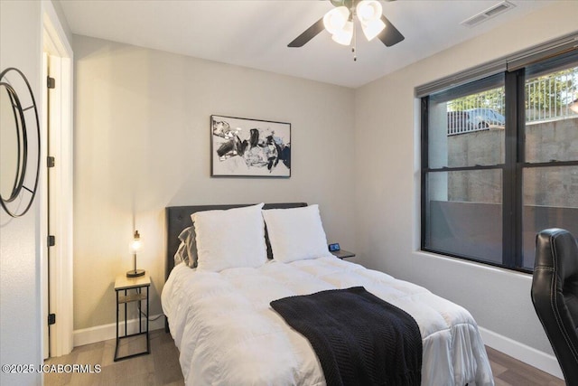 1055 Topsider Ln Unit 212, Osage Beach, MO 65065 - bedroom with wood finished floors and ceiling fan