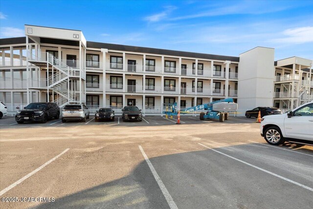 1055 Topsider Ln Unit 212, Osage Beach, MO 65065 - view of apartment building / complex featuring uncovered parking