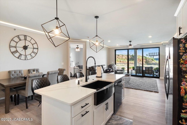 1055 Topsider Ln Unit 212, Osage Beach, MO 65065 - kitchen with freestanding refrigerator, a ceiling fan, open floor plan, light wood finished floors, and recessed lighting