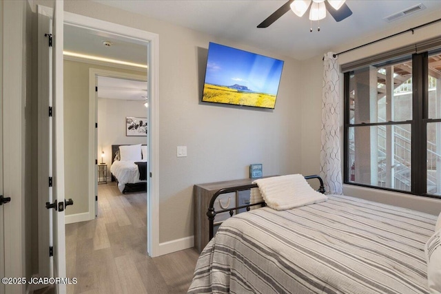 1055 Topsider Ln Unit 212, Osage Beach, MO 65065 - bedroom with light wood-type flooring and baseboards