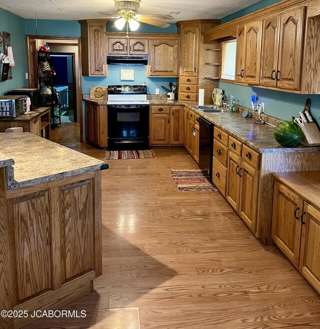508 S Poplar St, Chamois, MO 65024 - kitchen with electric range oven, dishwasher, light wood-style flooring, a ceiling fan, and a textured ceiling