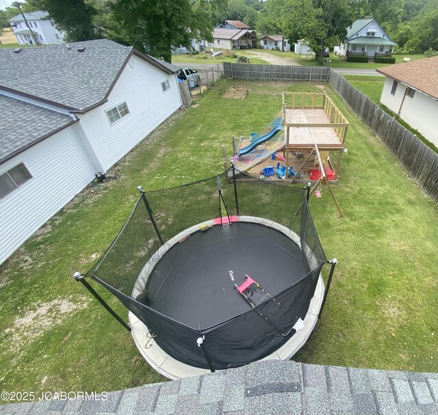 508 S Poplar St, Chamois, MO 65024 - fenced backyard with a trampoline and a playground