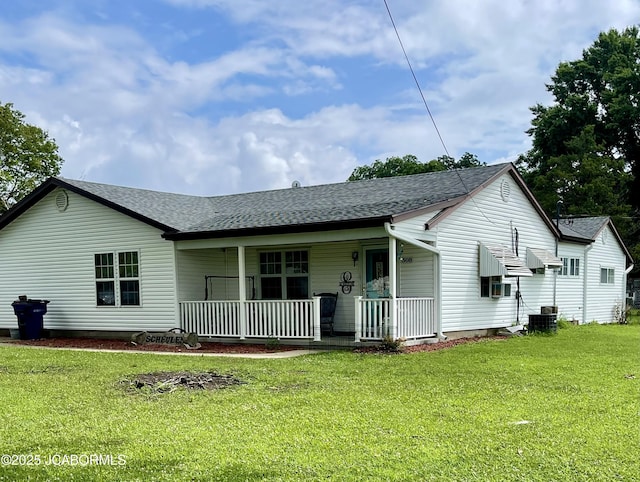 508 S Poplar St, Chamois, MO 65024 - back of house with a porch, a lawn, and a shingled roof
