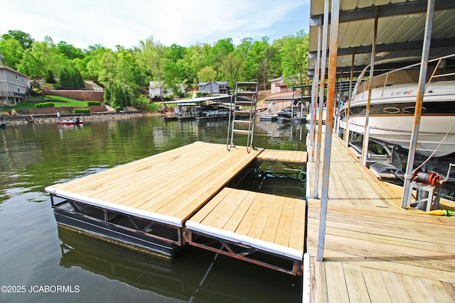 view of dock featuring boat lift and a water view
