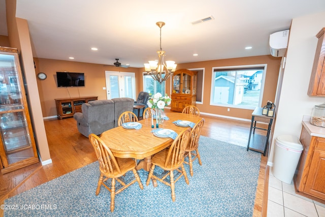 dining space featuring baseboards, recessed lighting, visible vents, and a chandelier