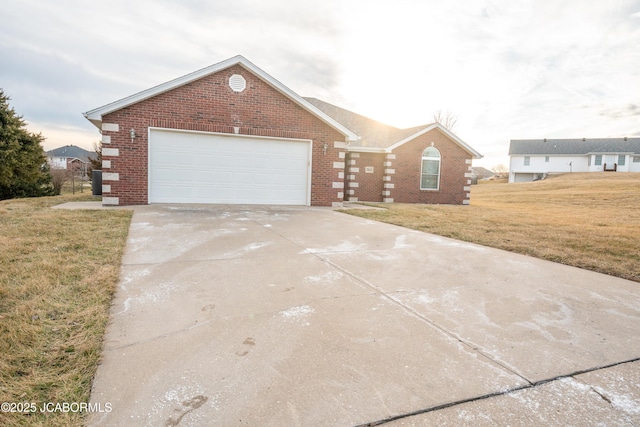 view of front of property with concrete driveway, a garage, brick siding, and a front lawn