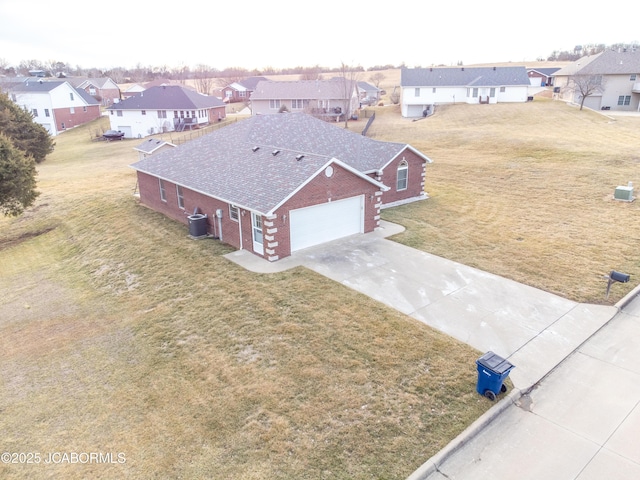 birds eye view of property with a residential view