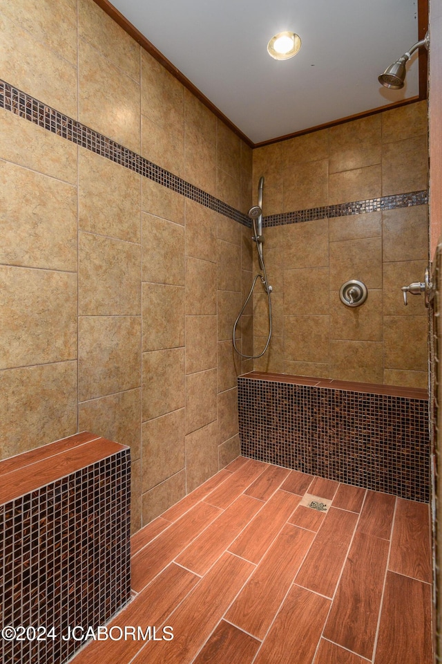 bathroom with a tile shower