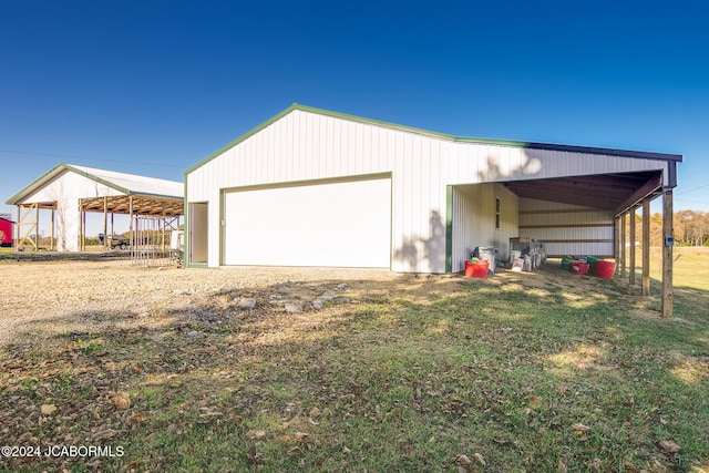 garage featuring a lawn