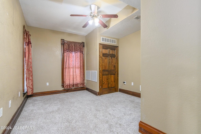 unfurnished bedroom with ceiling fan and light carpet