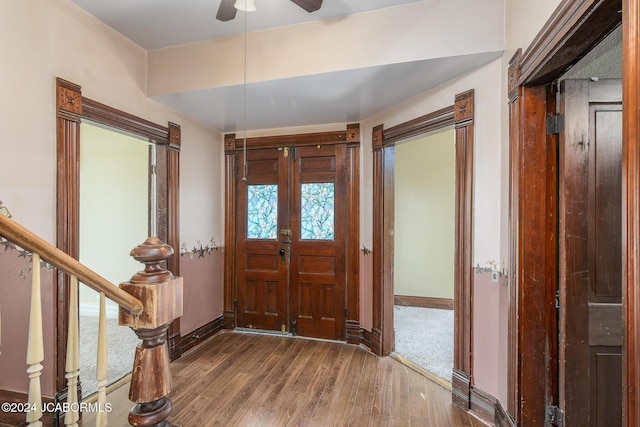 foyer entrance featuring hardwood / wood-style floors, french doors, and ceiling fan