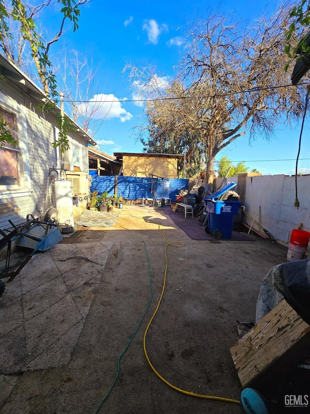 view of yard with a patio and a fenced backyard