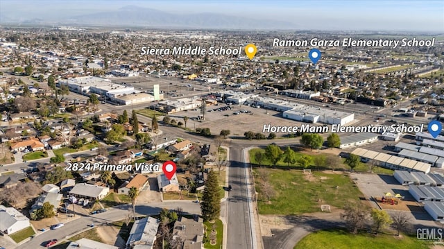 birds eye view of property featuring a mountain view