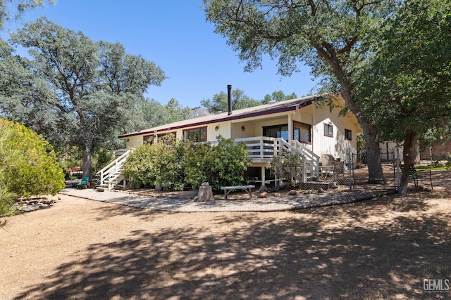3113 Raccoon Dr, Lake Isabella, CA 93240 - rear view of property featuring stairway