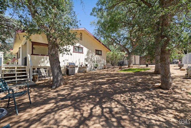 3113 Raccoon Dr, Lake Isabella, CA 93240 - view of home's exterior with a deck and stairway