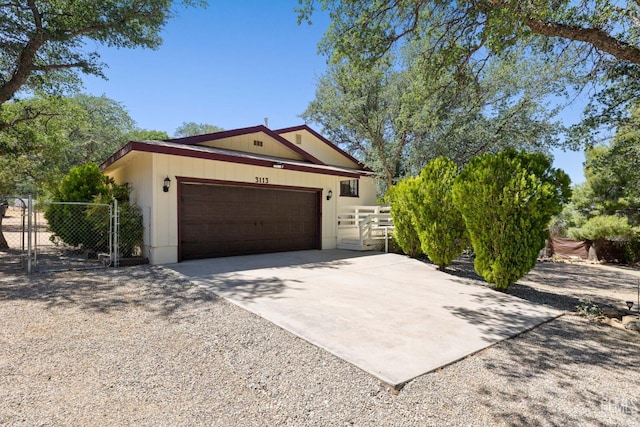 3113 Raccoon Dr, Lake Isabella, CA 93240 - ranch-style home with concrete driveway, a garage, and a gate