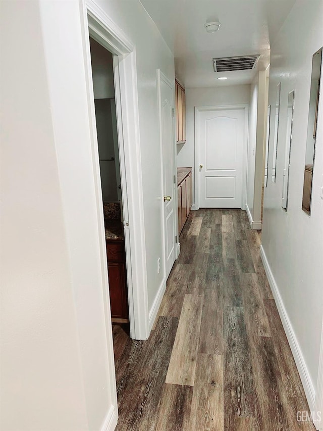7205 Colony Park Dr, Bakersfield, CA 93313 - hallway featuring dark wood-style floors and baseboards