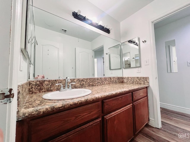 7205 Colony Park Dr, Bakersfield, CA 93313 - bathroom featuring wood finished floors and vanity