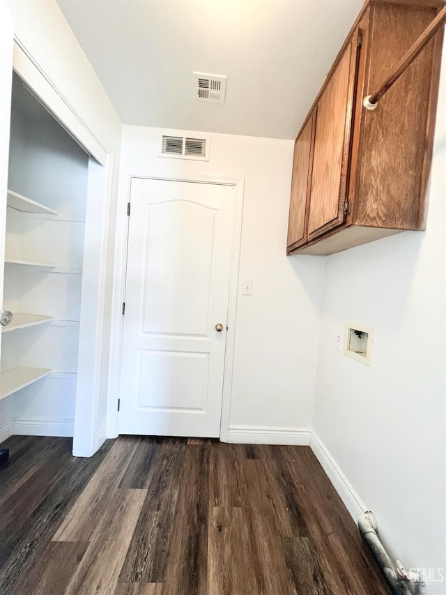 7205 Colony Park Dr, Bakersfield, CA 93313 - laundry area featuring cabinet space, dark wood-type flooring, and hookup for a washing machine