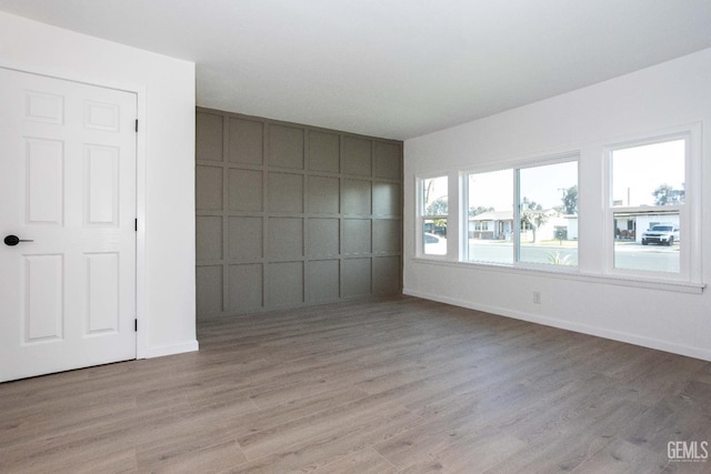 spare room with light hardwood / wood-style floors