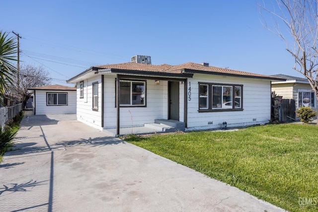 view of front of house with central AC and a front yard