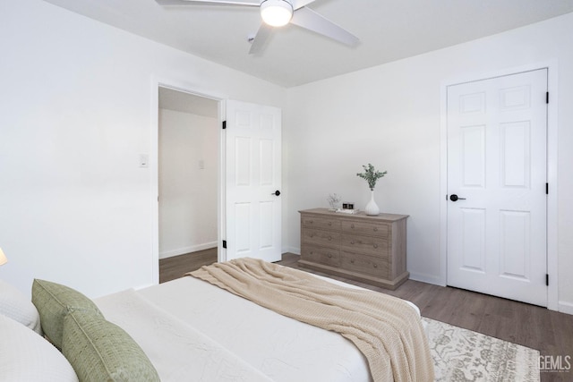 bedroom featuring dark hardwood / wood-style floors and ceiling fan