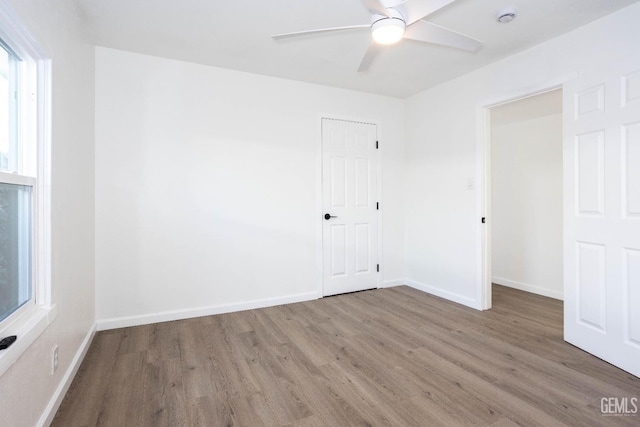 unfurnished bedroom with hardwood / wood-style flooring and ceiling fan