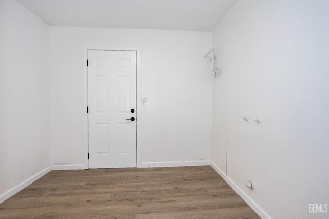 spare room with hardwood / wood-style floors