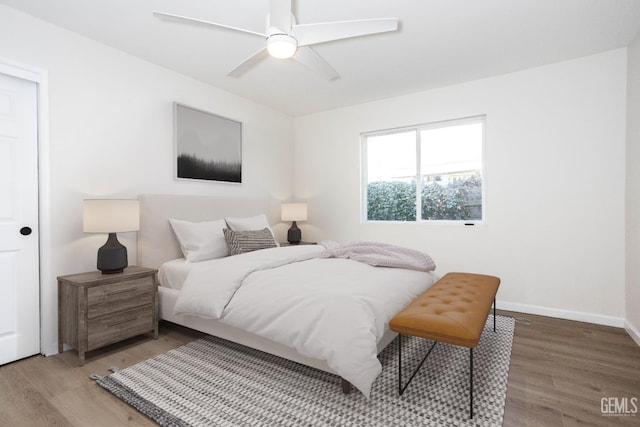 bedroom with hardwood / wood-style flooring and ceiling fan