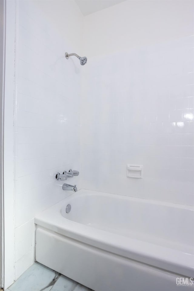 bathroom featuring washtub / shower combination