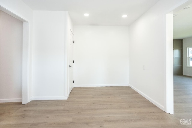 corridor with light wood-type flooring