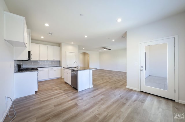 8412 Jean Anne St, Bakersfield, CA 93314 - kitchen featuring stainless steel appliances, a ceiling fan, light wood-style floors, dark countertops, and recessed lighting