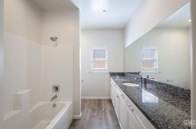 8412 Jean Anne St, Bakersfield, CA 93314 - full bathroom featuring vanity, plenty of natural light, wood finished floors, and bathing tub / shower combination