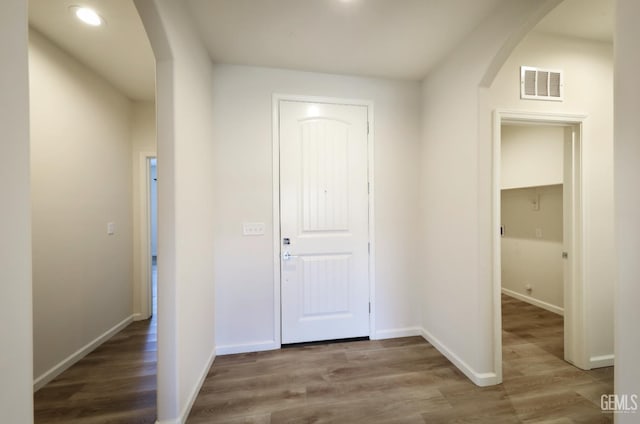 8412 Jean Anne St, Bakersfield, CA 93314 - hallway with arched walkways, wood finished floors, and recessed lighting